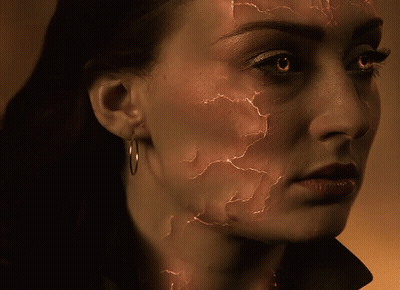 A Close Up Of A Woman 'S Face With Cracks GIF