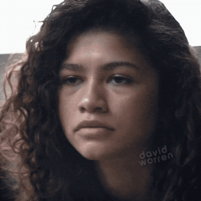A Close Up Of A Woman 'S Face With David Worren Written On The Bottom Right GIF