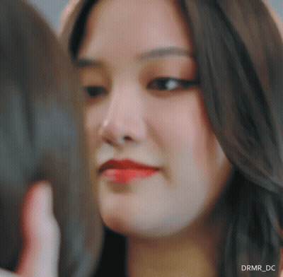A Close Up Of A Woman 'S Face With Drmr_dc Written In The Corner GIF