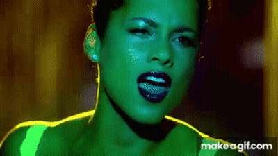 A Close Up Of A Woman 'S Face With Green And Blue Lipstick GIF