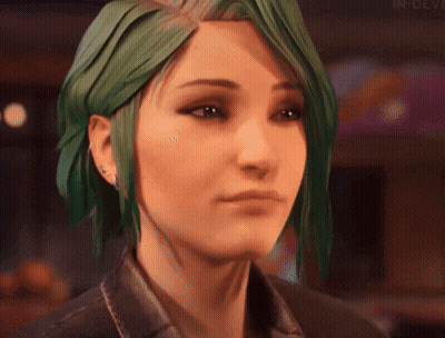 A Close Up Of A Woman 'S Face With Green Hair . GIF