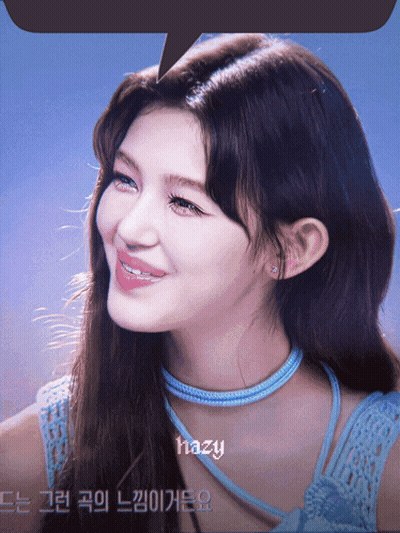 A Close Up Of A Woman 'S Face With Hazy Written Above Her GIF