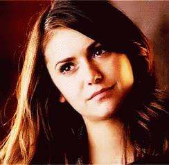 A Close Up Of A Woman 'S Face With Her Eyes Closed GIF