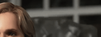 A Close Up Of A Woman 'S Face With Her Eyes Closed . GIF