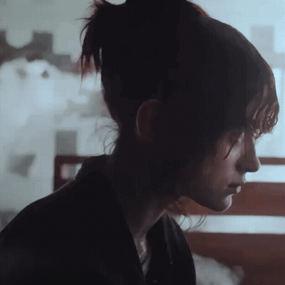 A Close Up Of A Woman 'S Face With Her Eyes Closed GIF