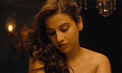 A Close Up Of A Woman 'S Face With Her Eyes Closed GIF