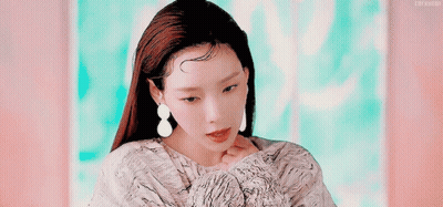 A Close Up Of A Woman 'S Face With Her Eyes Closed GIF