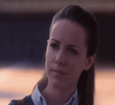 A Close Up Of A Woman 'S Face With Her Eyes Closed GIF