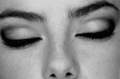 A Close Up Of A Woman 'S Face With Her Eyes Closed And Her Eyebrows Visible . GIF