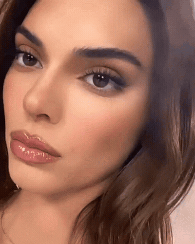Woman Face With Closed Eyes And Glossed Lips GIF