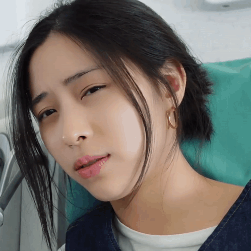 A Close Up Of A Woman 'S Face With Her Eyes Closed And Her Mouth Open GIF