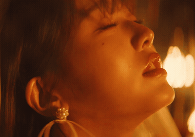 A Close Up Of A Woman 'S Face With Her Eyes Closed And Her Mouth Open GIF