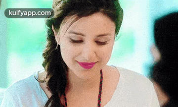 A Close Up Of A Woman 'S Face With Her Eyes Closed And Pink Lipstick . GIF