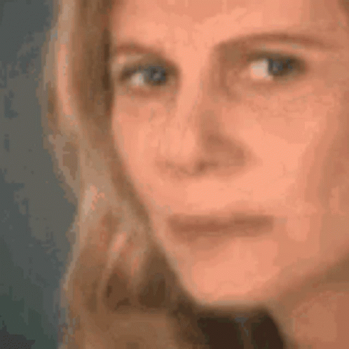 A Close Up Of A Woman 'S Face With Her Eyes Closed GIF