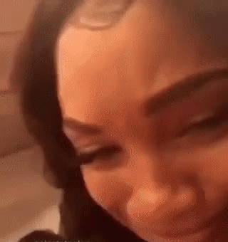 A Close Up Of A Woman 'S Face With Her Eyes Closed GIF
