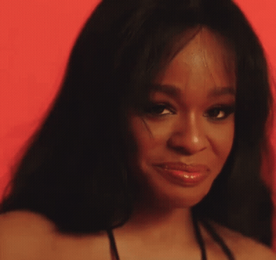 A Close Up Of A Woman 'S Face With Her Eyes Closed GIF