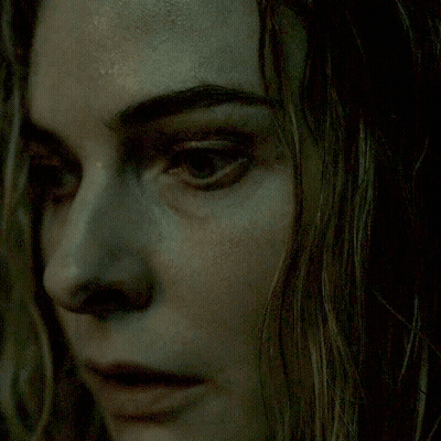 A Close Up Of A Woman 'S Face With Her Eyes Closed GIF