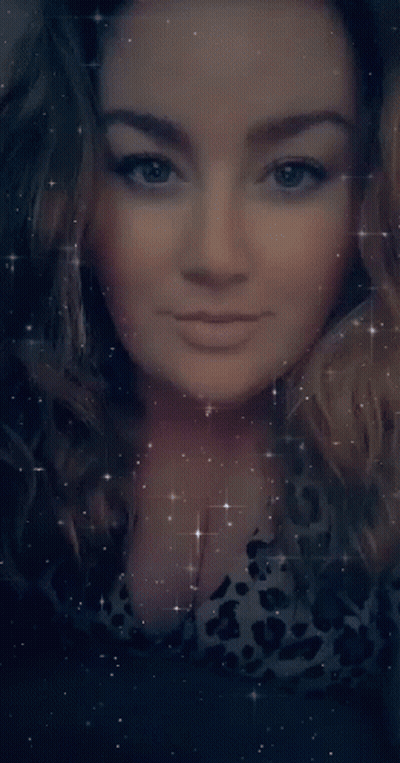 A Close Up Of A Woman 'S Face With Her Eyes Closed Surrounded By Stars GIF