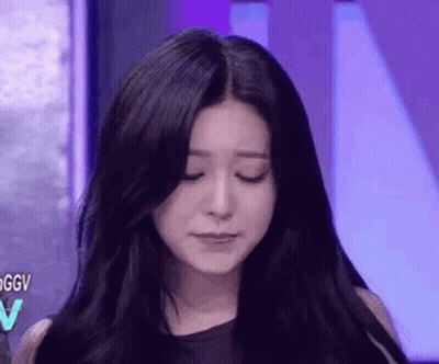 A Close Up Of A Woman 'S Face With Her Eyes Closed . GIF