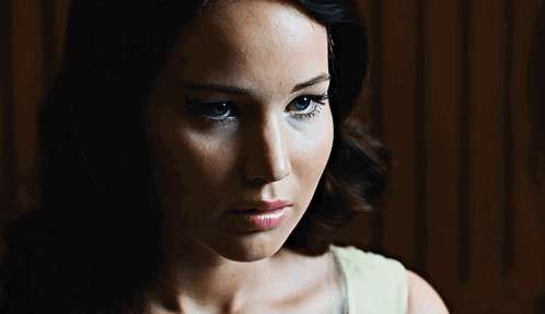 A Close Up Of A Woman 'S Face With Her Eyes Closed GIF