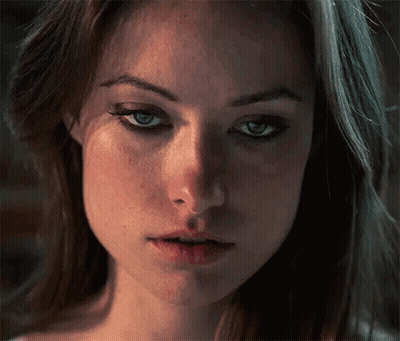 A Close Up Of A Woman 'S Face With Her Eyes Closed . GIF