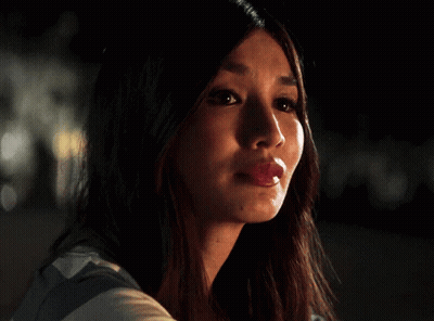 A Close Up Of A Woman 'S Face With Her Mouth Open GIF