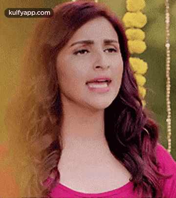 A Close Up Of A Woman 'S Face With Her Mouth Open . GIF