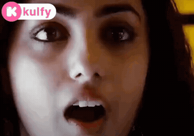 A Close Up Of A Woman 'S Face With Her Mouth Open And A Kolfy Logo In The Corner GIF