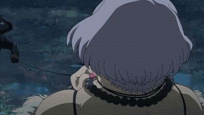 A Close Up Of A Woman 'S Face With Her Mouth Open And A Necklace Around Her Neck GIF