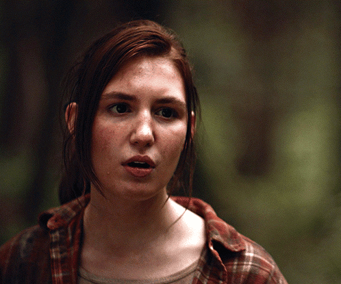 A Close Up Of A Woman 'S Face With Her Mouth Open GIF