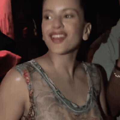 A Close Up Of A Woman 'S Face With Her Mouth Open GIF