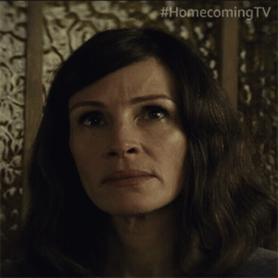 A Close Up Of A Woman 'S Face With #Homecomingtv Written On The Bottom GIF