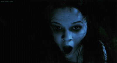A Close Up Of A Woman 'S Face With Horrordoll Written In The Bottom Right Corner GIF