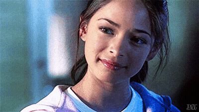 A Close Up Of A Woman 'S Face With Jenzg Written On The Bottom Right Corner GIF