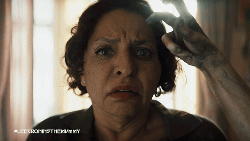 A Close Up Of A Woman 'S Face With #Leetroninthemummy Written On The Bottom GIF