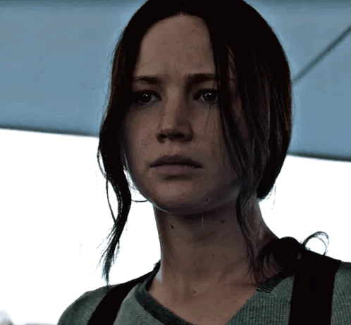 A Close Up Of A Woman 'S Face With Long Hair GIF