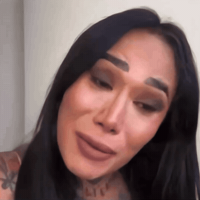A Close Up Of A Woman 'S Face With Makeup On Her Eyebrows GIF