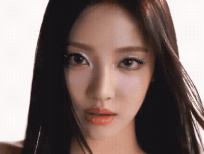 A Close Up Of A Woman 'S Face With Makeup On Her Eyes GIF