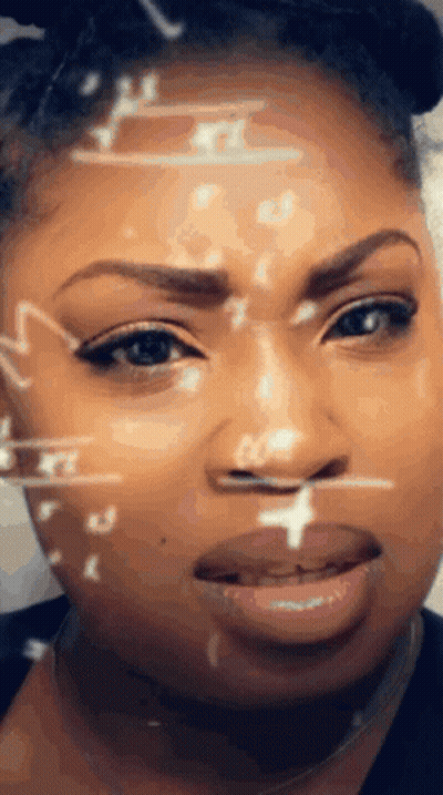 A Close Up Of A Woman 'S Face With Mathematical Symbols On It GIF