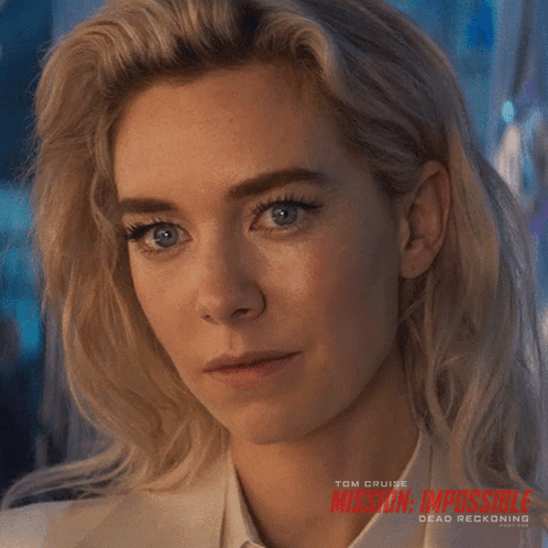 A Close Up Of A Woman 'S Face With Mission Impossible Dead Reckoning Written On The Bottom GIF