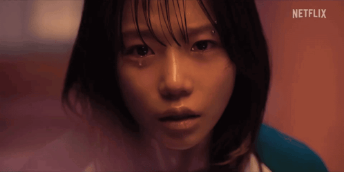 A Close Up Of A Woman 'S Face With Netflix Written On The Bottom GIF