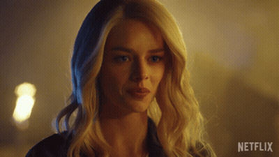 A Close Up Of A Woman 'S Face With Netflix Written On The Bottom GIF