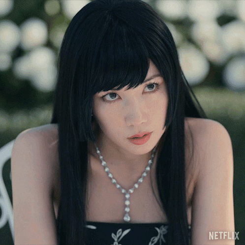 A Close Up Of A Woman 'S Face With Netflix Written On The Bottom Right GIF