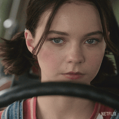 A Close Up Of A Woman 'S Face With Netflix Written On The Bottom Right GIF