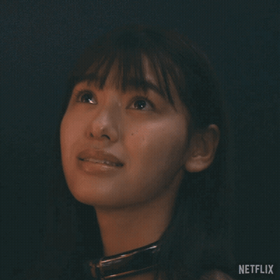 A Close Up Of A Woman 'S Face With Netflix Written On The Bottom Right GIF