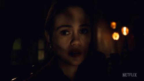 A Close Up Of A Woman 'S Face With Netflix Written On The Bottom Right GIF
