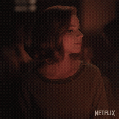 A Close Up Of A Woman 'S Face With Netflix Written On The Bottom GIF
