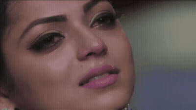 A Close Up Of A Woman 'S Face With Pink Lipstick On GIF