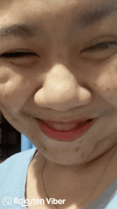 A Close Up Of A Woman 'S Face With Rakuten Viber Written On The Bottom Right GIF