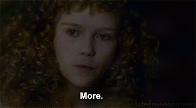 A Close Up Of A Woman 'S Face With Red Curly Hair And The Words `` More '' . GIF